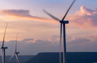 风能源风权力可持续发展的可再生能源风涡轮机生成电风车农场山日落天空绿色技术可再生资源可持续发展的发展