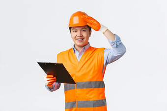 建筑部门工业工人概念快乐的微笑亚洲建设经理检查员头盔安全手套耶和华见证人工程师持有剪贴板给许可