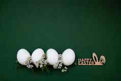 节日复活节白色鸡蛋白色小花绿色背景