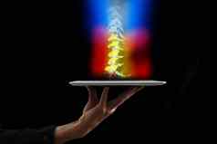 医生持有数字平板电脑x射线脊柱骨架红色的疼痛骨头