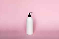白色塑料肥皂自动售货机泵瓶孤立的粉红色的背景皮肤护理乳液洗澡至关重要的产品洗发水瓶浴身体乳液细液体手洗浴室配件