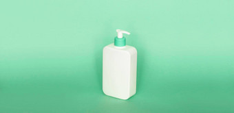 白色塑料肥皂自动售货机泵瓶孤立的绿色背景皮肤护理<strong>乳液</strong>洗澡至关重要的产品洗发水瓶浴身体<strong>乳液</strong>细<strong>液</strong>体手洗浴室配件