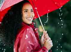 下雨倒美丽的年轻的女人站雨伞