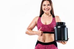 快乐健康的肌肉发达的年轻的健身体育女人运动员Jar体育营养蛋白质获得者酪蛋白