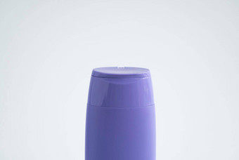 紫罗兰色的<strong>塑料瓶</strong>身体护理美产品工作室摄影<strong>塑料瓶</strong>洗发水淋浴过来这里噪音孤立的白色背景