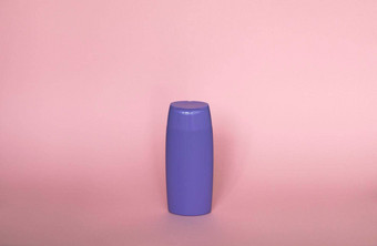紫罗兰色的塑料<strong>瓶身</strong>体护理美产品工作室摄影塑料<strong>瓶</strong>洗发水淋浴过来这里噪音孤立的粉红色的背景