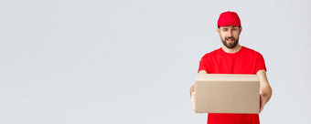 订单交付在线购物包航运概念厚颜无耻的英俊的有胡子的快递红色的统一的将盒子包客户端员工眨眼给订单包裹