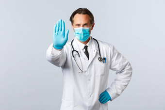 科维德防止病毒医疗保健工人疫苗接种概念医生医疗面具手套扩展手显示停止防止不同意限制需求社会距离