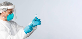 科维德防止病毒医疗保健工人疫苗接种概念医生个人保护设备填满注射器冠状病毒疫苗疾病治疗医院病房