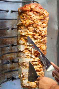 老板切割Doner刀传统的土耳其Doner烤肉串肉