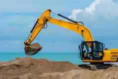 石油行业重机海挖掘机建设沙子轮廓业务矿业桶挖掘权力地球黄色的挖掘挖掘工作石头石头
