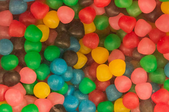彩色的咀嚼片甜蜜的糖糖果有害的婴儿食物背景
