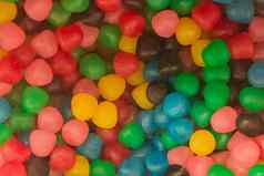 彩色的咀嚼片甜蜜的糖糖果有害的婴儿食物背景
