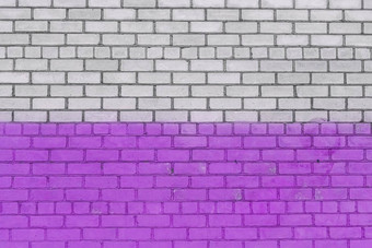 白色砖墙画紫色的油漆城市设计背景纹理
