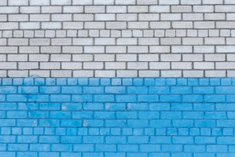 白色砖墙画蓝色的油漆城市设计背景纹理