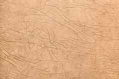 米色光皮革沙发室内装潢摘要裂缝模式纹理背景