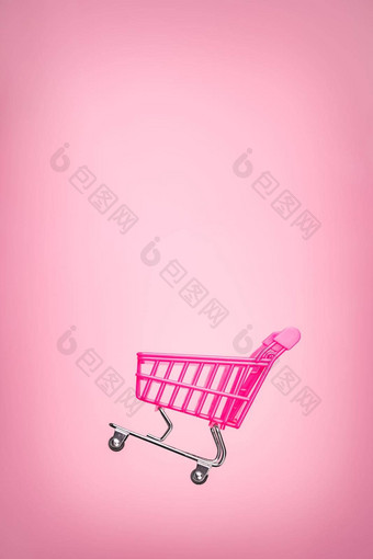 空电车车孤立的粉红色的<strong>背景</strong>粉红色的购物电车超市概念玩具粉红色的概念销售在线购物车超市销售购物象征商务出售车<strong>商店</strong>在线