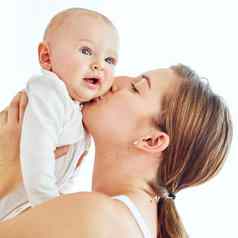 爱的有爱心的充满深情的妈妈。接吻成键婴儿女拥抱母亲持有婴儿空气享受甜蜜的时刻爱护理幸福