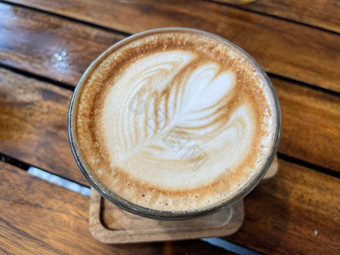 美丽的杯卡布奇诺咖啡咖啡拿铁艺术木空间背景