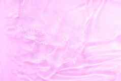 粉红色的过来这里纹理化妆品清晰的液体涂抹透明的皮肤护理产品