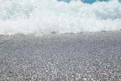 卵石海滩Azure海水纹理背景清晰的海水卵石海滩纯水石头海岸海岸线用石头砸海岸华丽的海景假期夏天天堂