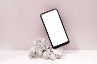模型<strong>模板智能</strong>手机平衡自然石头粉红色的背景电话空白屏幕<strong>模板</strong>