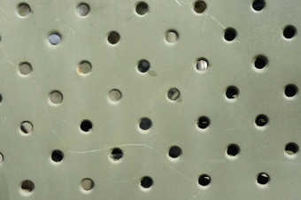 晶格纹理关闭孔灰色金属板轮常规的孔纹理背景军事纹理晶格建设军事车辆绿色保护颜色