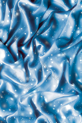 魔法假期蓝色的软丝绸平铺背景纹理发光的雪奢侈品美摘要背景