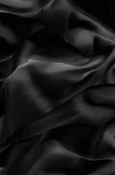 奢侈品黑色的软丝绸平铺背景纹理假期魅力摘要背景