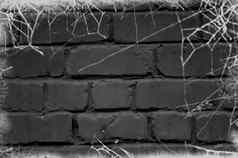 黑色的砖墙覆盖白色蜘蛛网背景万圣节设计海报海报横幅网站头的地方文本空空间