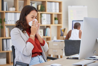 生病的生病了打喷嚏业务女人冷流感过敏工作办公室工作狂经理工作桌子上科维德疾病病毒坏工作生活平衡工作场所