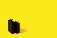 黑色的购物袋间隙出售黄色的背景黑色的星期五简约概念复制空间