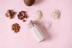 平躺食物作文植物基于牛奶有益健康的坚果谷物种子粉红色的背景复制空间