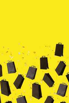 模式黑色的出售购物袋飞行黄色的背景复制空间黑色的星期五有创意的概念