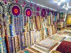 少数民族地毯观赏人袋华丽的枕头刺绣亚洲商店商店亚洲市场贸易公平乌兹别克斯坦传统的国家点缀亚洲工艺品乌兹别克工艺