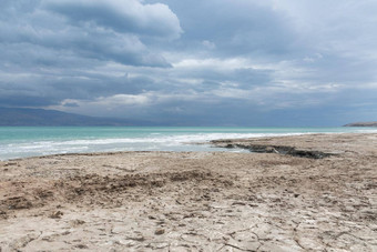 风暴雨死海海岸线盐晶体日落纹理死海咸海滨