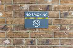 吸烟标志建筑警告标志砖墙背景信息禁止吸烟