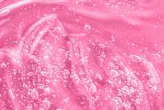 粉红色的面具涂片涂抹过来这里血清液体奶油胶原蛋白视黄醇神经酰胺样本透明质酸酸碳粉视黄醇神经酰胺果冻纹理化妆品产品