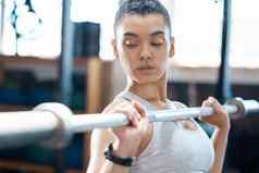锻炼健身锻炼女人杠铃健身房健康有氧运动健康健康的强度体育健美运动员运动员培训重量提升肌肉权力竞争
