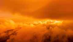 红色的燃烧日落海岩石火山悬崖摘要自然夏天春天海洋海背景小波金温暖的水表面散景灯太阳