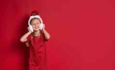 长横幅女孩圣诞节衣服惊喜笑红色的背景