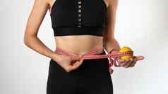 女人措施数字丝带柠檬手重量损失健康的吃体育