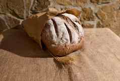 有益健康的粮食黑麦面包工艺eco-paper袋耳朵小麦表格覆盖粗麻布桌布