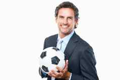 业务男人。持有足球肖像微笑业务男人。持有足球白色背景