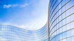 玻璃建筑业务概念玻璃外观摩天大楼镜子反射天空窗户明亮的阳光明媚的一天阳光蓝色的天空现代建筑背景呈现