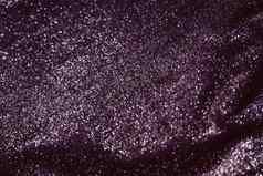 紫色的假期闪闪发光的闪闪发光的摘要背景奢侈品闪亮的织物材料魅力设计节日邀请