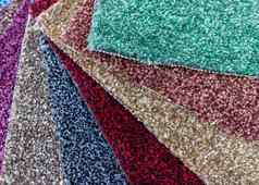 色彩斑斓的地毯块整齐安排色彩斑斓的纹理背景