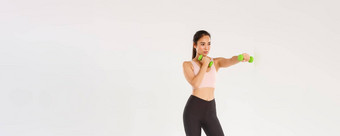 体育运动健身房健康的身体概念完整的长度集中女阿塞尔特亚洲浅黑肤色的女人女孩健身练习锻炼哑铃实践太极拳白色背景