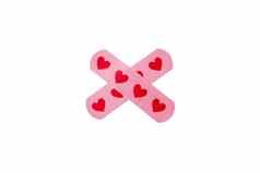 医疗胶粘剂磁带石膏粉红色的心孤立的白色背景交叉形状的保护护理