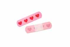 医疗胶粘剂磁带石膏粉红色的心孤立的白色背景保护护理